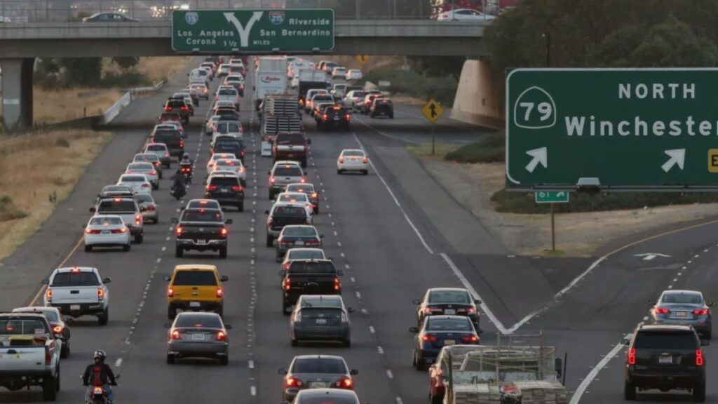"Heavy traffic on the I-15 Freeway through Temecula, illustrating increased congestion during peak hours.