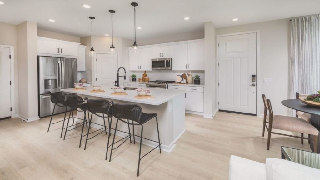 Interior of a newly built townhome in Winchester, CA showcasing open-concept living and kitchen space.