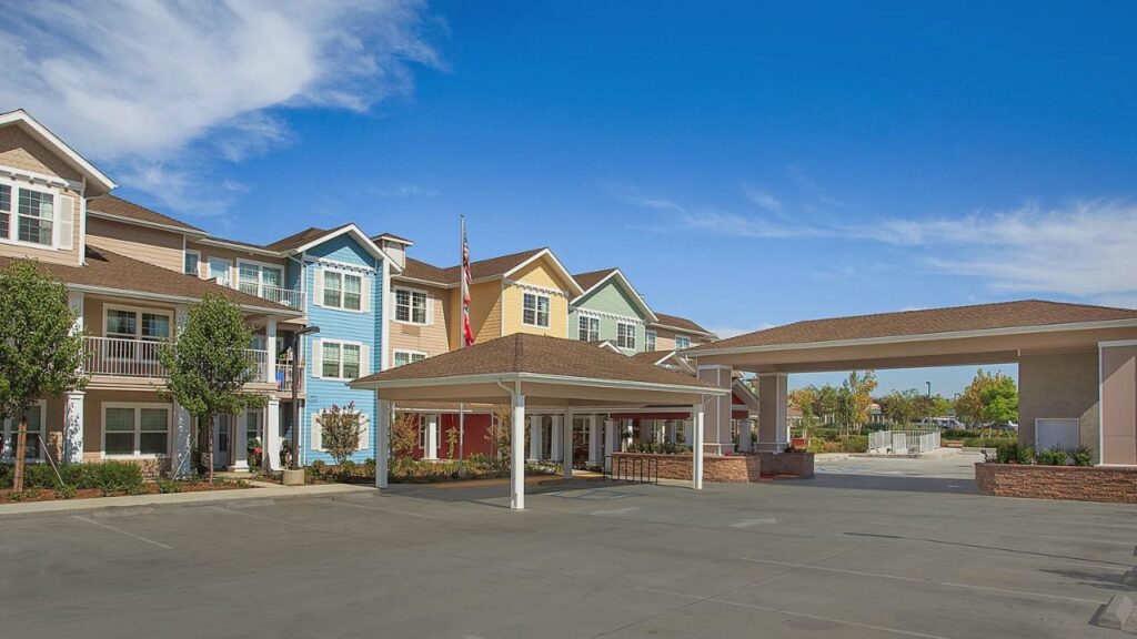 Holiday Chateau at Harveston senior living community in Temecula offering meals, care services, and lake-view walking paths